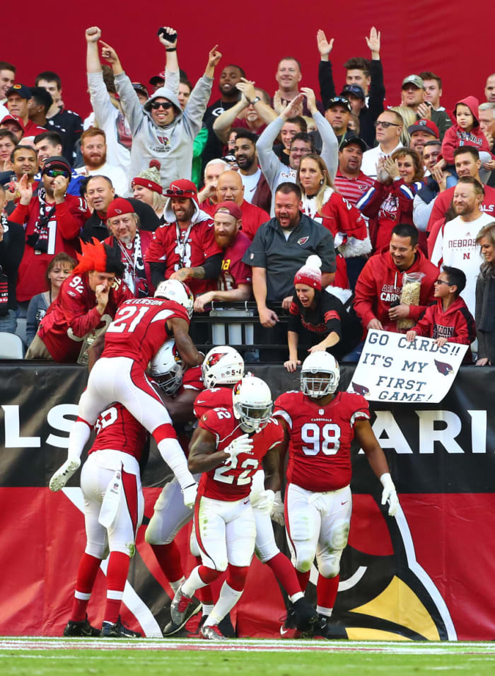 Cardinals players celebrate with defensive tackle Calais Campbell (93) after returning a fumble for a touchdown in the second quarter against the Saints at University of Phoenix Stadium.